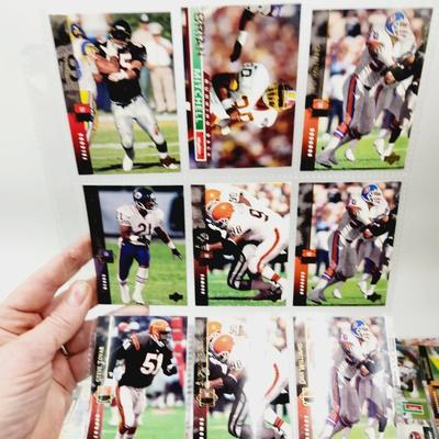 234 COLLECTABLE FOOTBALL CARDS IN PROTECTIVE SLEEVES - ROOKIES INCLUDED
