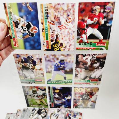 234 COLLECTABLE FOOTBALL CARDS IN PROTECTIVE SLEEVES - ROOKIES INCLUDED