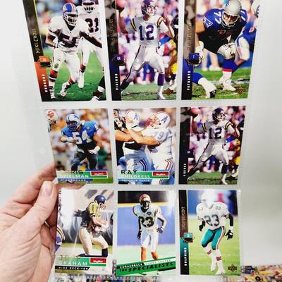 234 COLLECTABLE FOOTBALL CARDS IN PROTECTIVE SLEEVES - ROOKIES INCLUDED