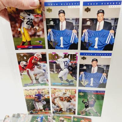 234 COLLECTABLE FOOTBALL CARDS IN PROTECTIVE SLEEVES - ROOKIES INCLUDED