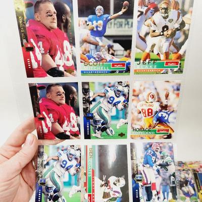 234 COLLECTABLE FOOTBALL CARDS IN PROTECTIVE SLEEVES - ROOKIES INCLUDED