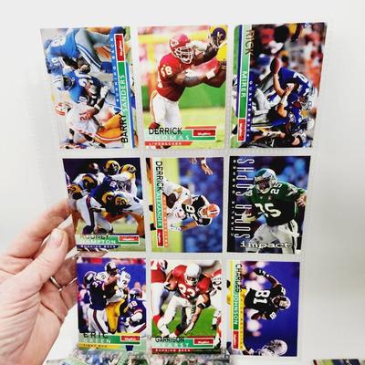 234 COLLECTABLE FOOTBALL CARDS IN PROTECTIVE SLEEVES - ROOKIES INCLUDED