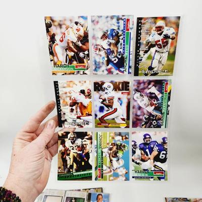 234 COLLECTABLE FOOTBALL CARDS IN PROTECTIVE SLEEVES - ROOKIES INCLUDED