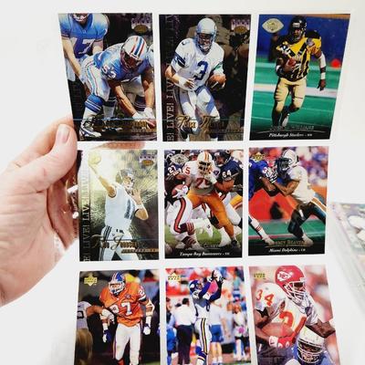 225 COLLECTABLE FOOTBALL CARDS W/ PROTECTIVE SLEEVES