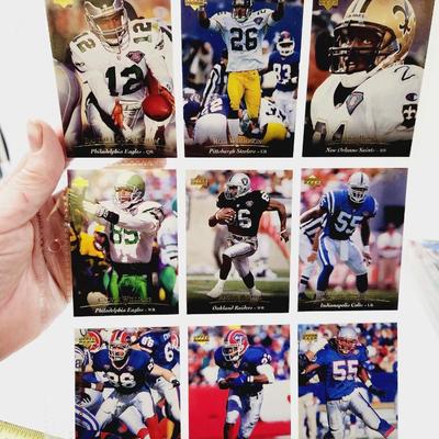 225 COLLECTABLE FOOTBALL CARDS W/ PROTECTIVE SLEEVES