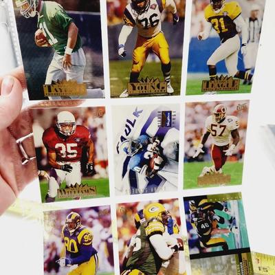 225 COLLECTABLE FOOTBALL CARDS W/ PROTECTIVE SLEEVES
