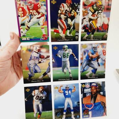 225 COLLECTABLE FOOTBALL CARDS W/ PROTECTIVE SLEEVES