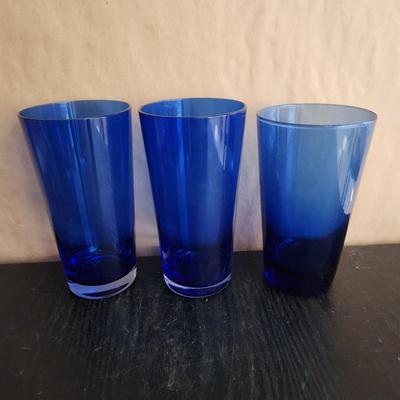 Three blue glass cups