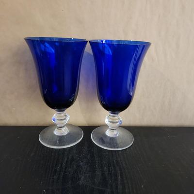 Two blue glass wine glasses