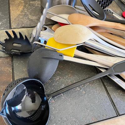 Two jars of kitchen utensils