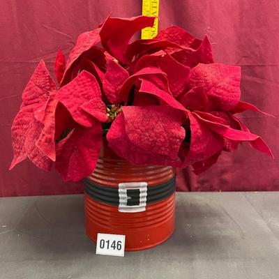 Silk poinsettia in a holiday can