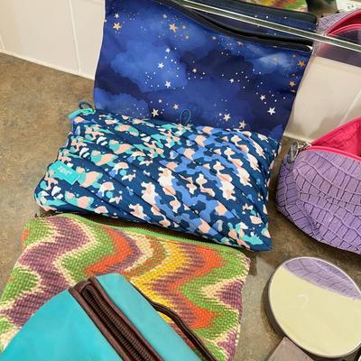 Lot of makeup and makeup bags