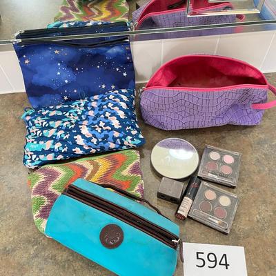 Lot of makeup and makeup bags