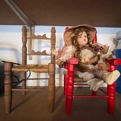 Two doll chairs and a doll