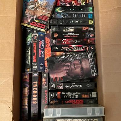 Full box of vintage VHS tapes