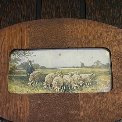 Antique artwork of sheep and its herder