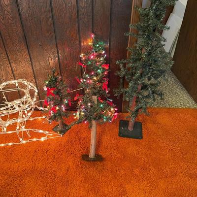 3 small Christmas trees
