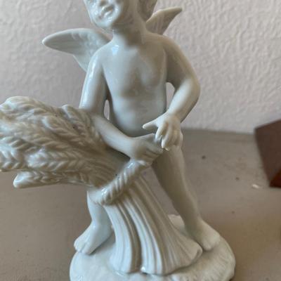 Collection of four cherub figurines