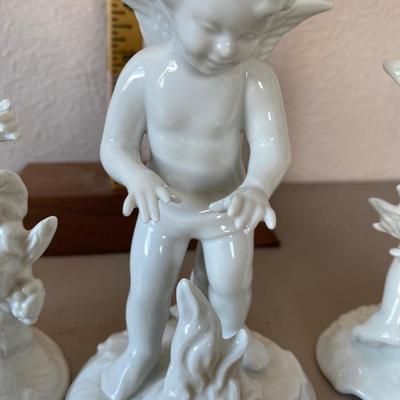 Collection of four cherub figurines