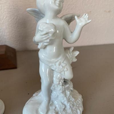 Collection of four cherub figurines