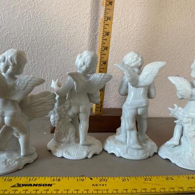 Collection of four cherub figurines