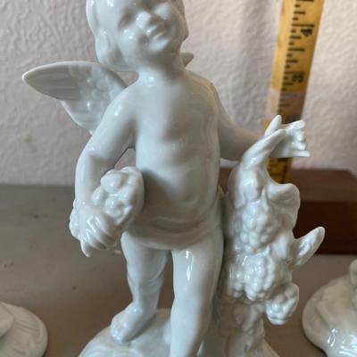 Collection of four cherub figurines