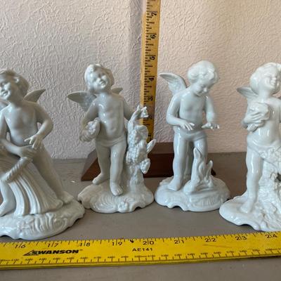 Collection of four cherub figurines