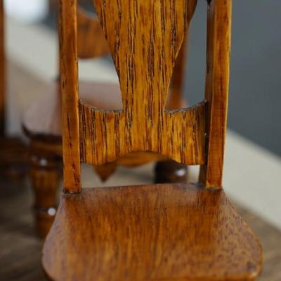 MINIATURE GROUPING OF A 1920'S DINING ROOM OAK FURNITURE , SOFA AND TABLE AND CHAIRS