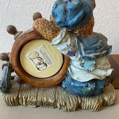 Teddy bear figurine with clock