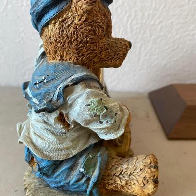 Teddy bear figurine with clock