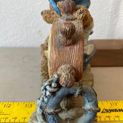 Teddy bear figurine with clock
