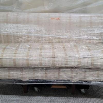 Cream and tan leather stripe settee 