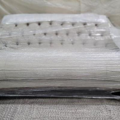 Tufted modern rounded sofa with metal details 