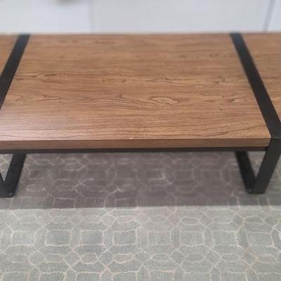 Modern wood and metal cocktail table 
H13" W55" D28"
$299