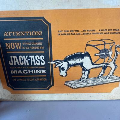 Novelty, jackass cigarette, dispensing machine