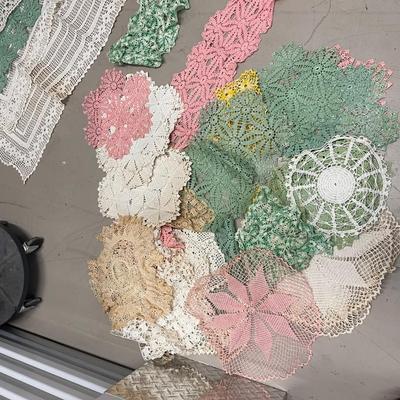 Lot of vintage hand-crocheted doilies and table runners.  40 doilies and 12 table runners.