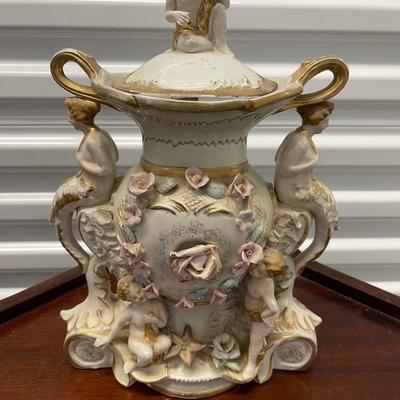 Very fancy vintage vase/urn with lid. Angels, mermaids and cherub.  12” high