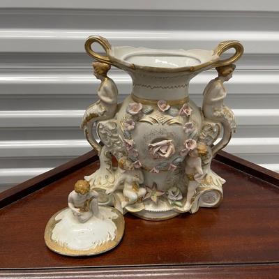 Very fancy vintage vase/urn with lid. Angels, mermaids and cherub.  12” high
