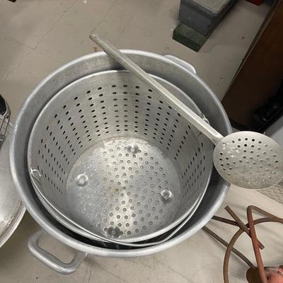 Large seafood boiling pot  includes stainer basket, large metal stirrer, and 2 ladles. Also includes burner.  21” high.