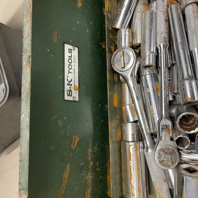 Green metal box of tools