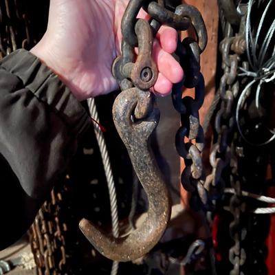 Large Lot of Chains, Metal Cables, Hooks, and Pulley of Varying Sizes and Lengths
