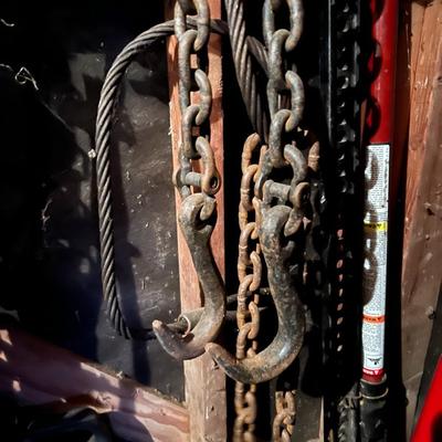 Large Lot of Chains, Metal Cables, Hooks, and Pulley of Varying Sizes and Lengths