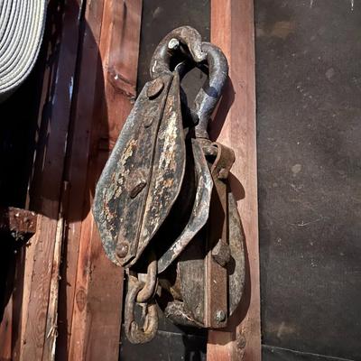 Large Lot of Chains, Metal Cables, Hooks, and Pulley of Varying Sizes and Lengths