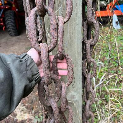 Large Lot of Chains, Metal Cables, Hooks, and Pulley of Varying Sizes and Lengths