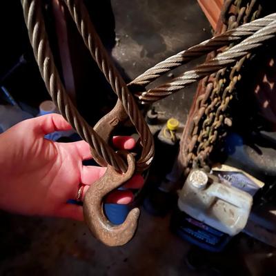 Large Lot of Chains, Metal Cables, Hooks, and Pulley of Varying Sizes and Lengths