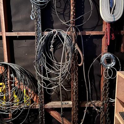 Large Lot of Chains, Metal Cables, Hooks, and Pulley of Varying Sizes and Lengths