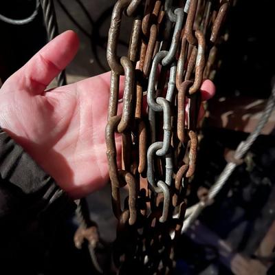 Large Lot of Chains, Metal Cables, Hooks, and Pulley of Varying Sizes and Lengths
