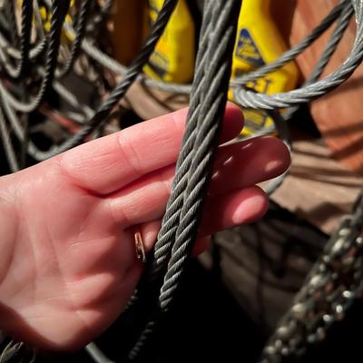 Large Lot of Chains, Metal Cables, Hooks, and Pulley of Varying Sizes and Lengths