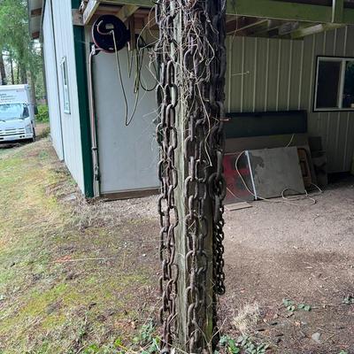 Large Lot of Chains, Metal Cables, Hooks, and Pulley of Varying Sizes and Lengths