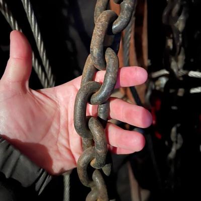 Large Lot of Chains, Metal Cables, Hooks, and Pulley of Varying Sizes and Lengths